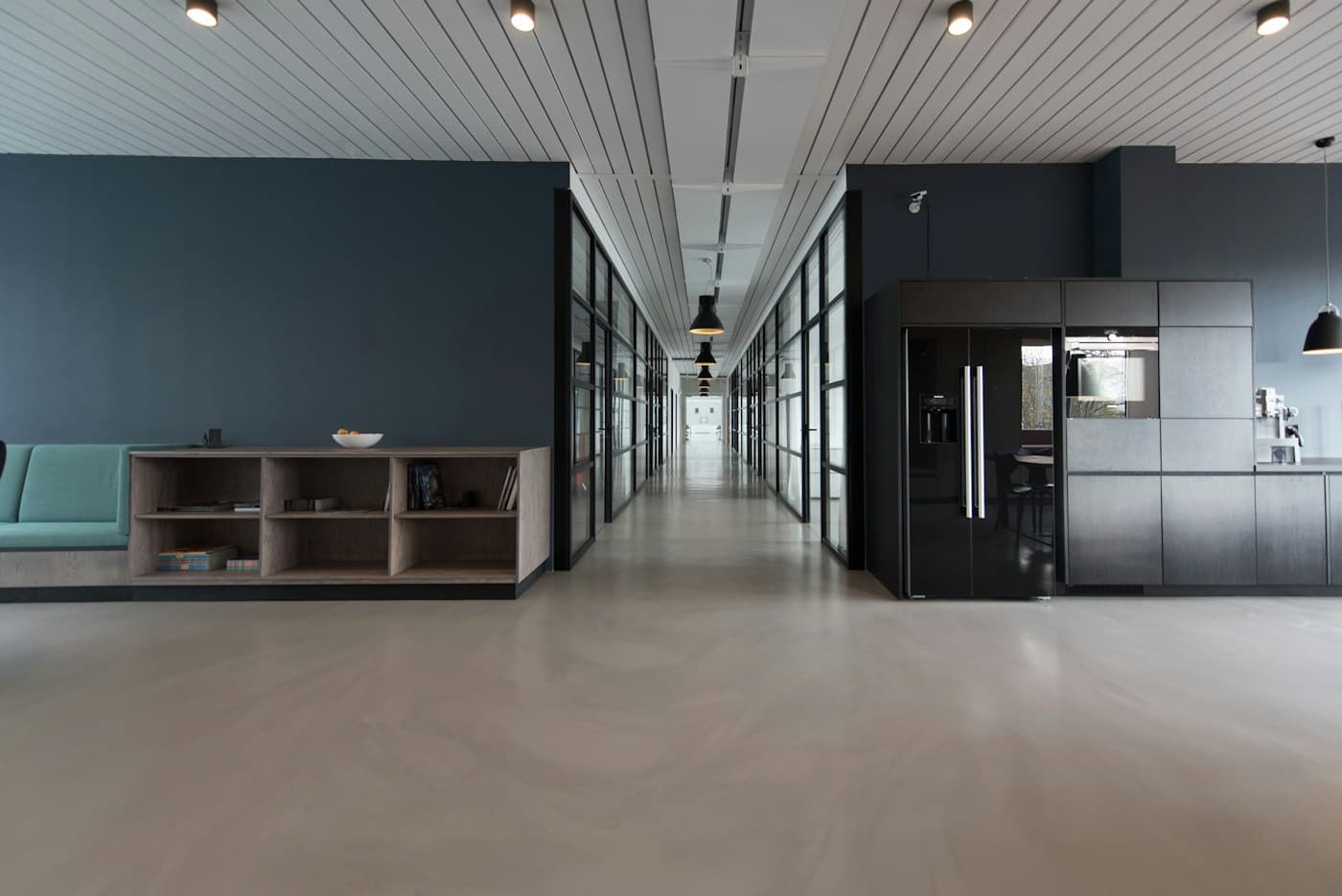 Open workspace with natural light and glass meeting rooms